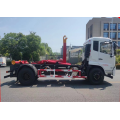 Multi-purpose hook arm garbage truck